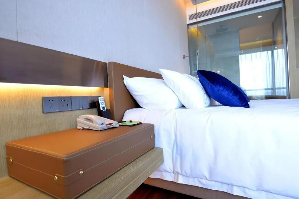 Bed in AUGUSTINE HOTEL