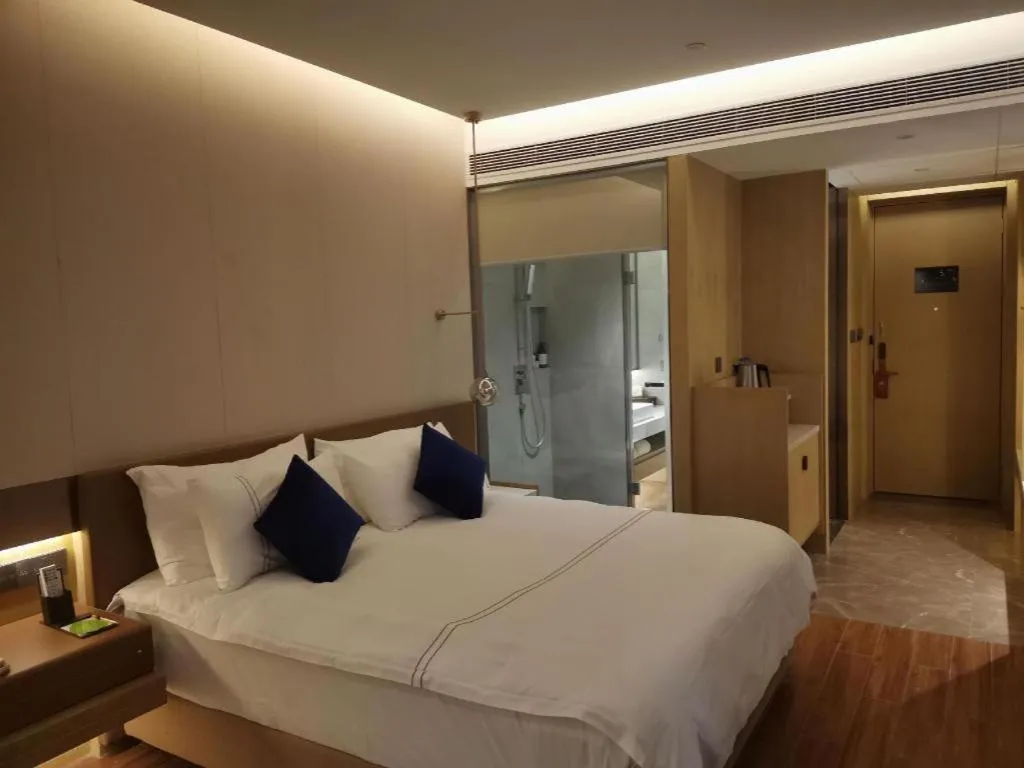 Bed in AUGUSTINE HOTEL