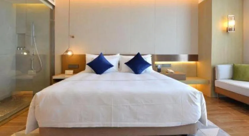 Bed in AUGUSTINE HOTEL