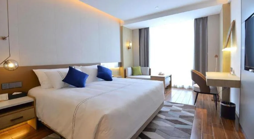 Bed in AUGUSTINE HOTEL