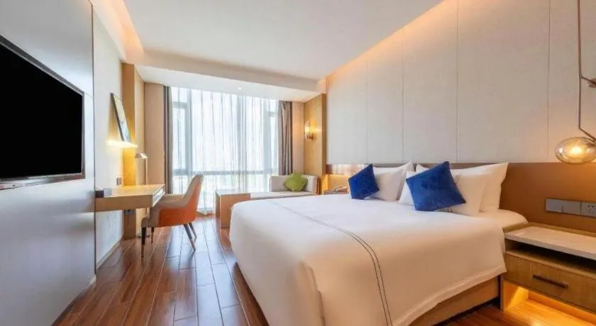 Bed in AUGUSTINE HOTEL