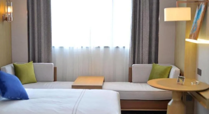 Bed in AUGUSTINE HOTEL