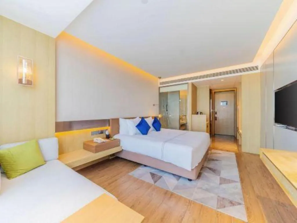 Bed in AUGUSTINE HOTEL