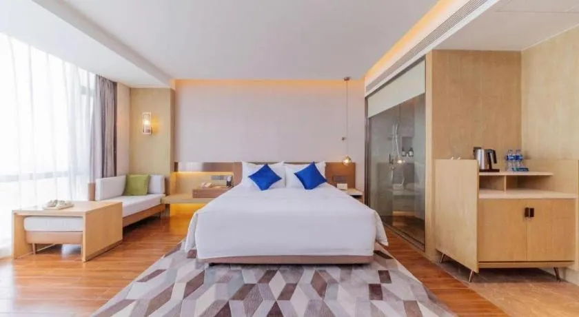 Bed in AUGUSTINE HOTEL