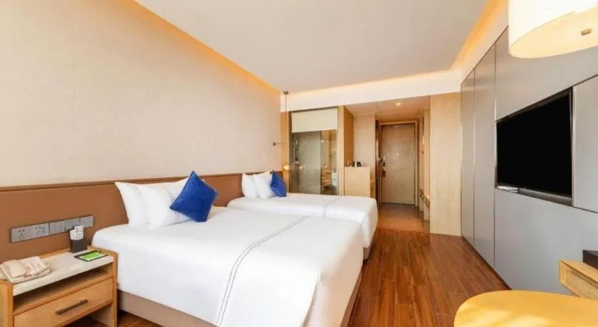 Bed in AUGUSTINE HOTEL