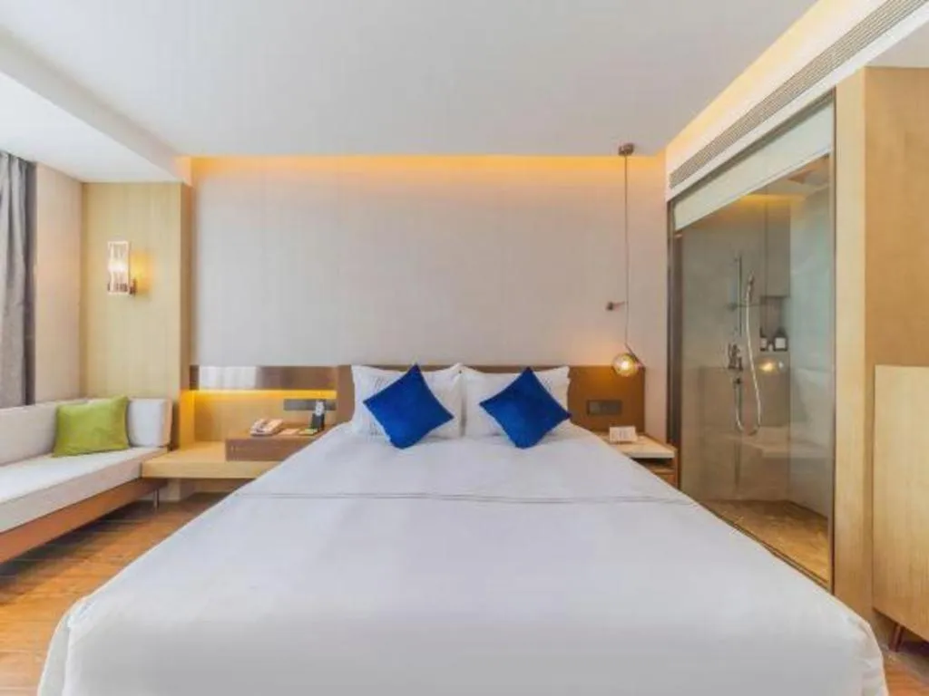 Bed in AUGUSTINE HOTEL