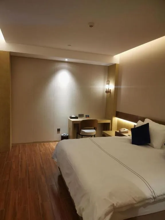 Bed in AUGUSTINE HOTEL