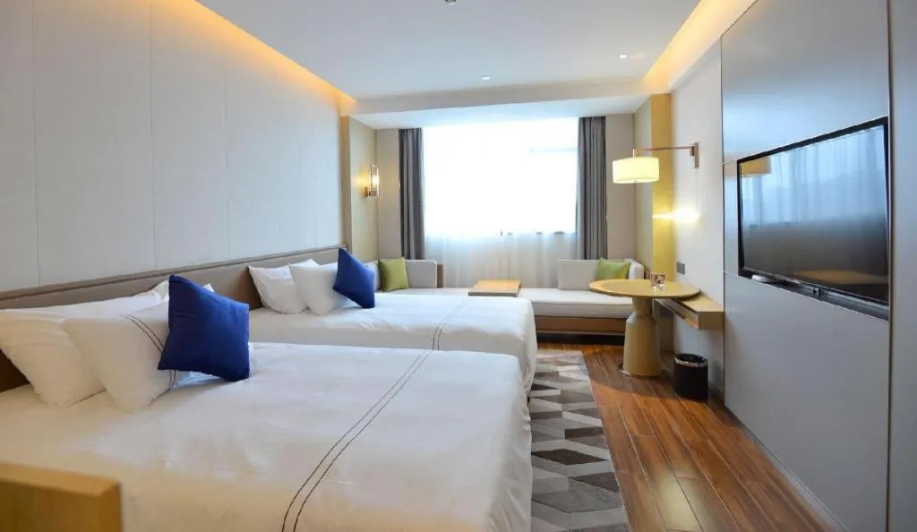 Bed in AUGUSTINE HOTEL