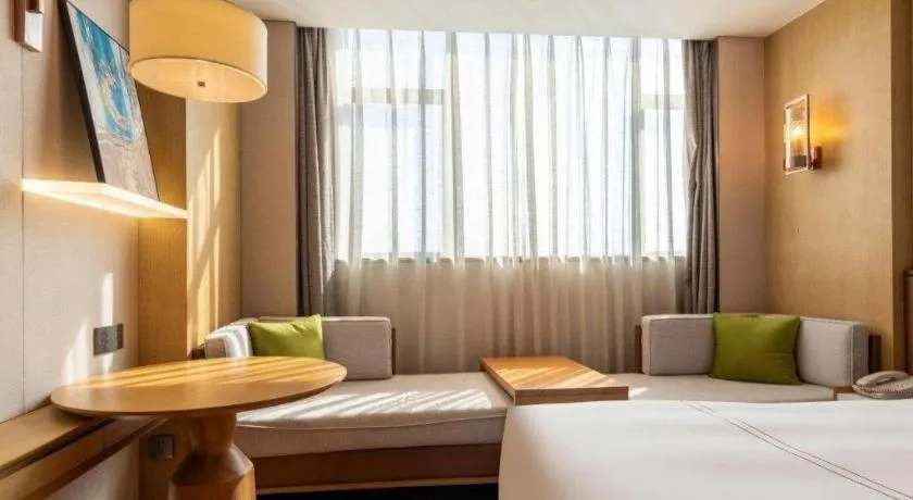 Bed in AUGUSTINE HOTEL