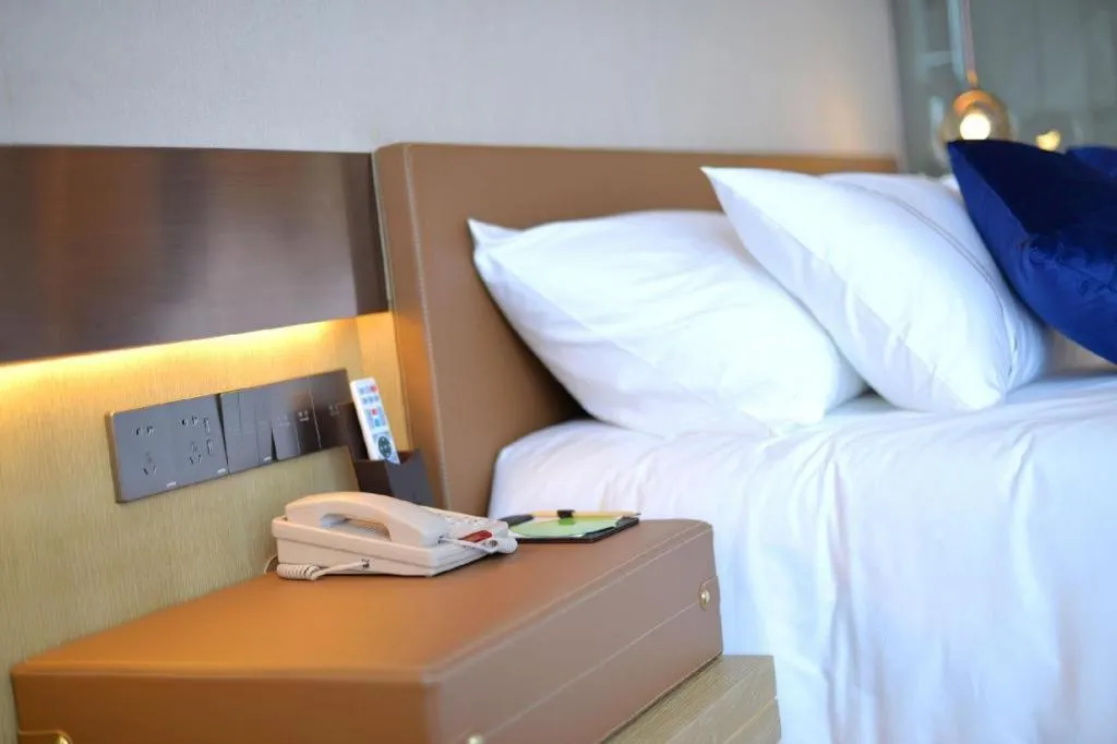 Bed in AUGUSTINE HOTEL