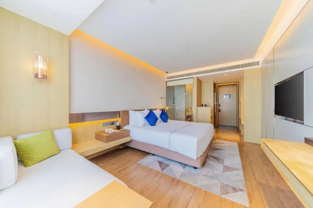 Bed in AUGUSTINE HOTEL