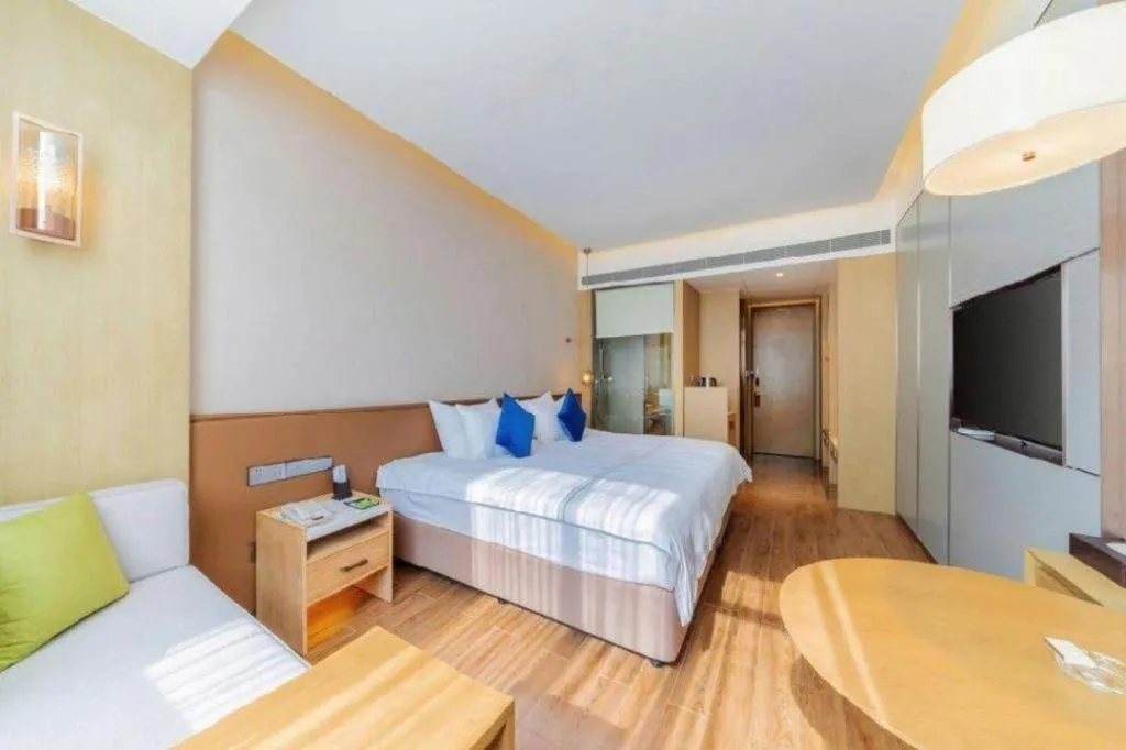 Bed in AUGUSTINE HOTEL