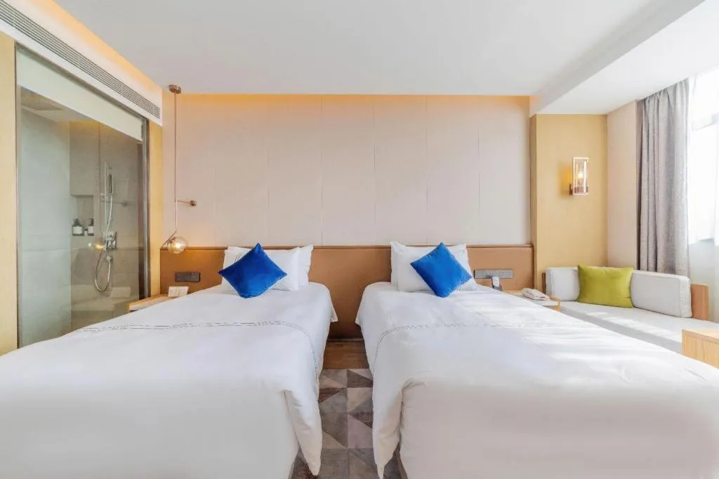 Bed in AUGUSTINE HOTEL