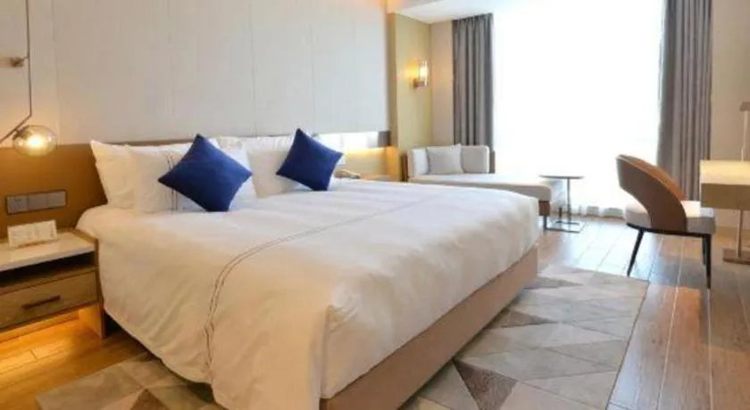 Bed in AUGUSTINE HOTEL