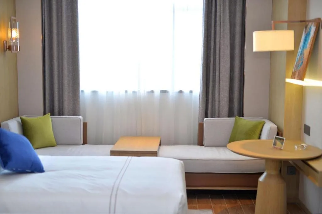 Bed in AUGUSTINE HOTEL