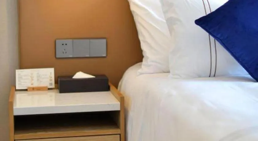 Bed in AUGUSTINE HOTEL