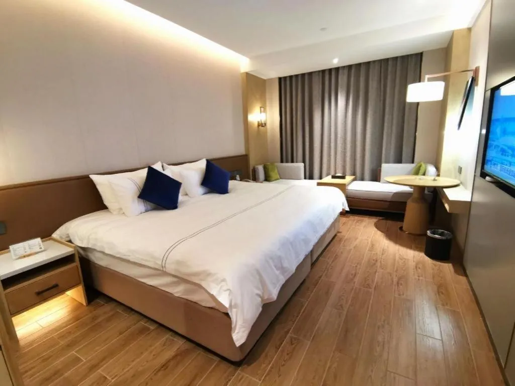 Bed in AUGUSTINE HOTEL