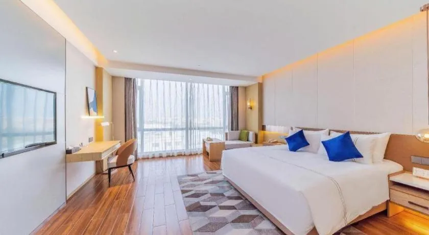 Bed in AUGUSTINE HOTEL