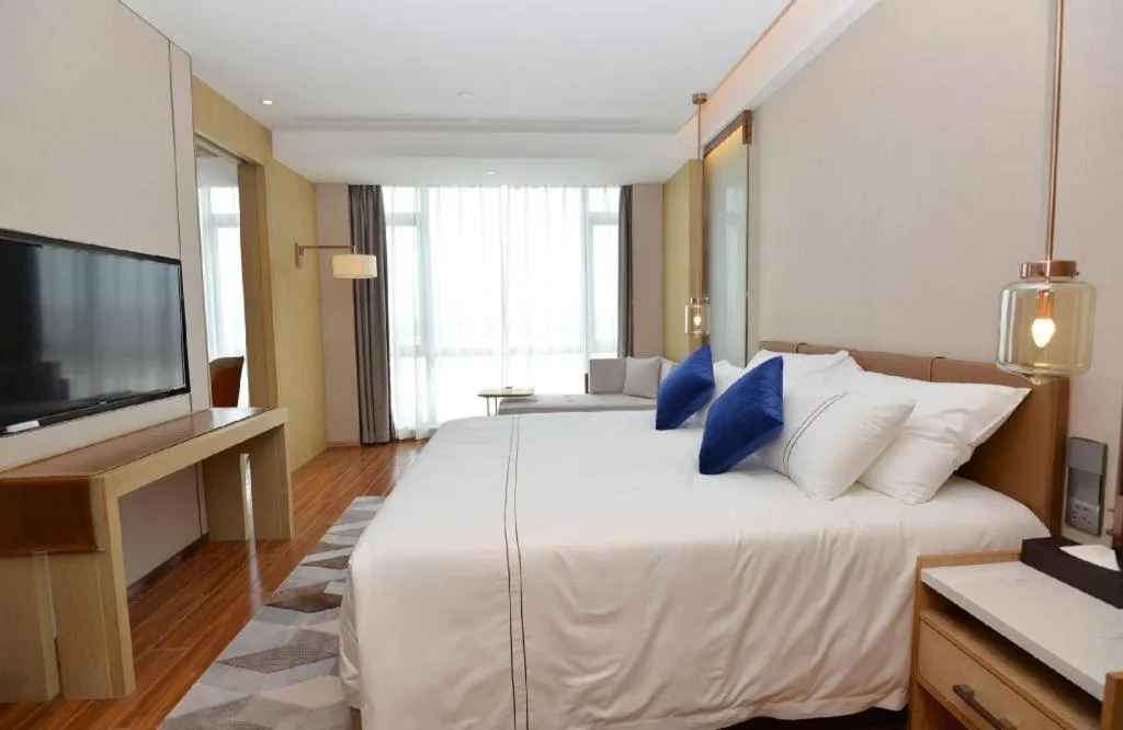 Bed in AUGUSTINE HOTEL