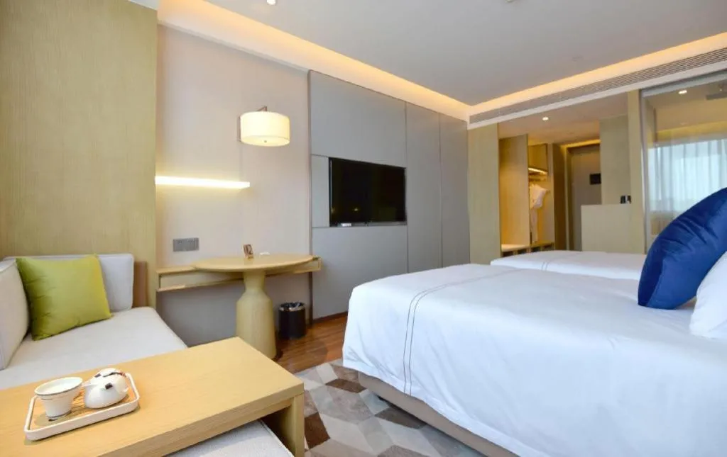 Bed in AUGUSTINE HOTEL