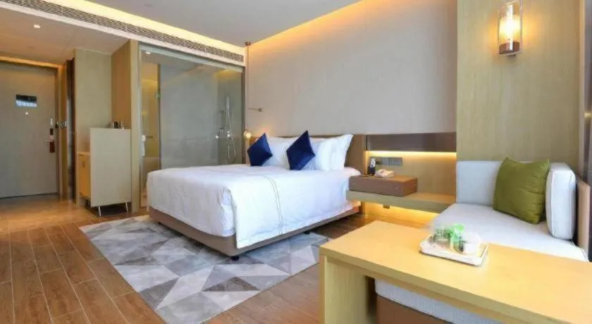 Bed in AUGUSTINE HOTEL