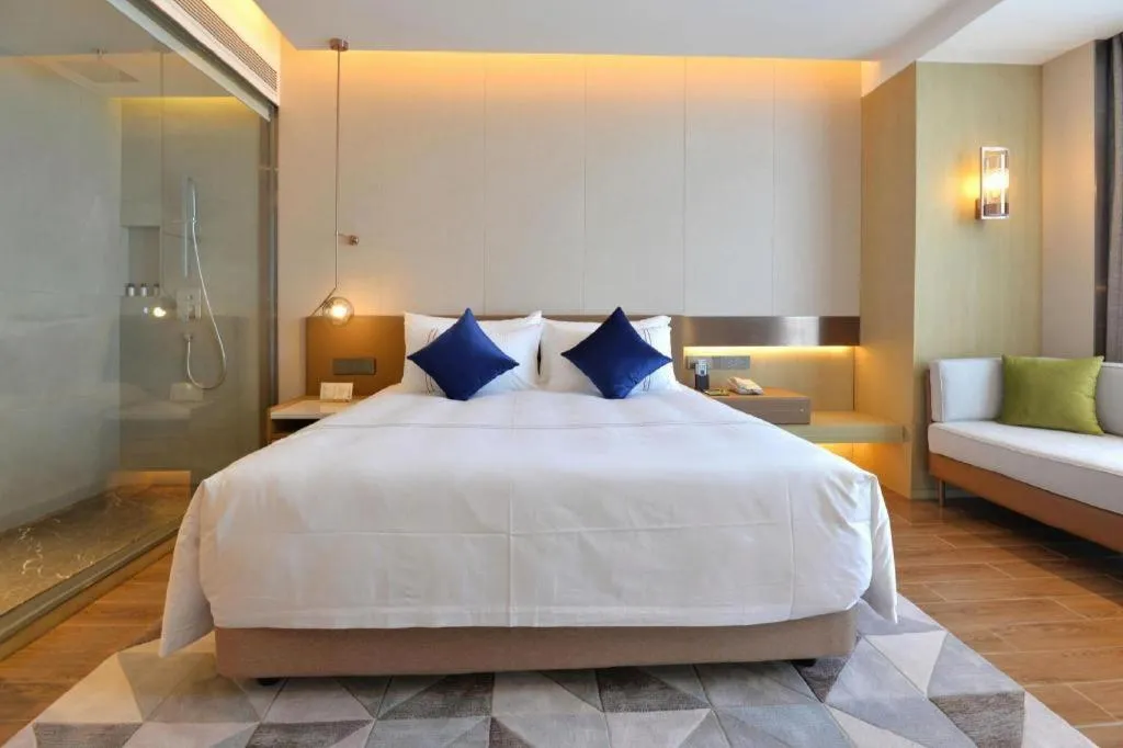 Bed in AUGUSTINE HOTEL