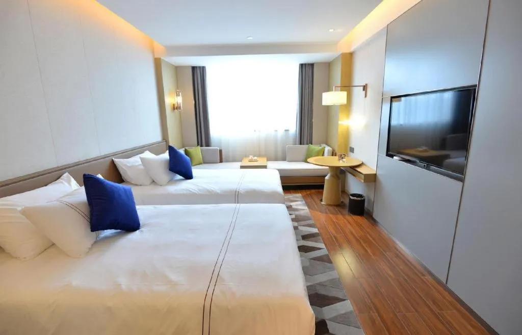 Bed in AUGUSTINE HOTEL