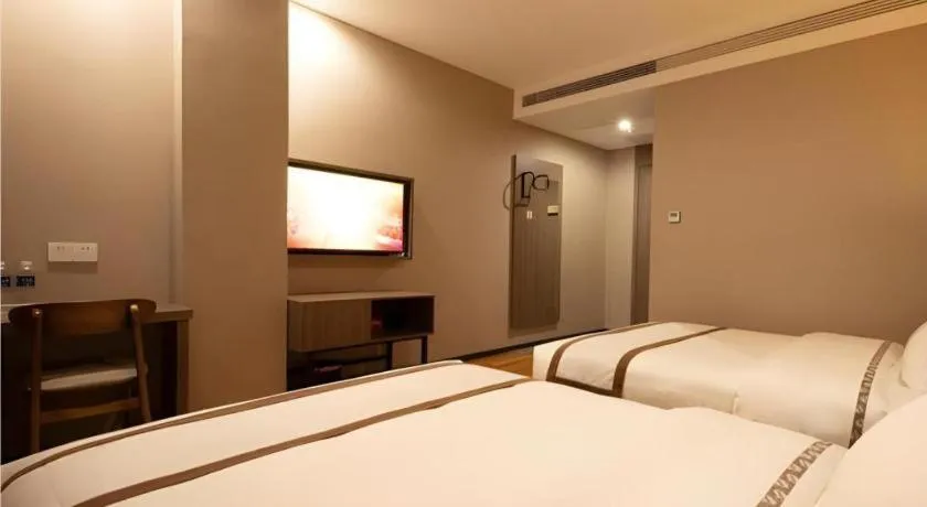 Bed in Jtour Inn Wuxi Meiyuan Kaiyuan Temple Metro