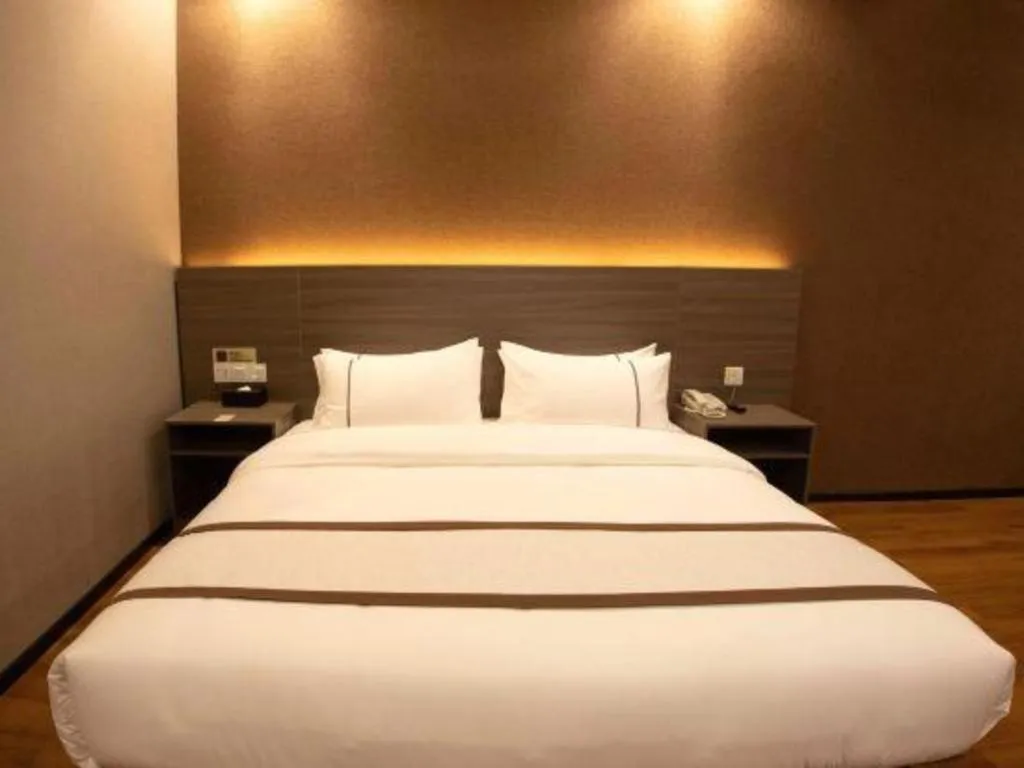 Bed in Jtour Inn Wuxi Meiyuan Kaiyuan Temple Metro