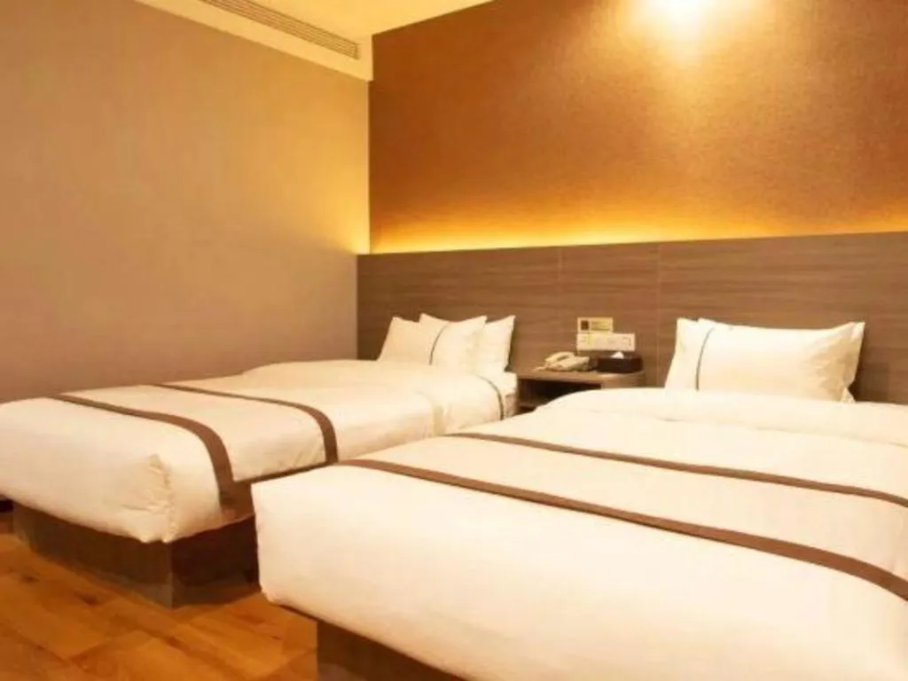 Bed in Jtour Inn Wuxi Meiyuan Kaiyuan Temple Metro