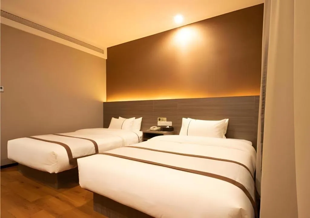 Bed in Jtour Inn Wuxi Meiyuan Kaiyuan Temple Metro