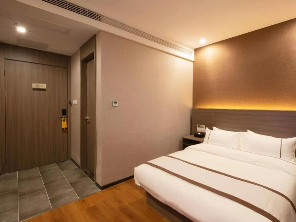 Bed in Jtour Inn Wuxi Meiyuan Kaiyuan Temple Metro