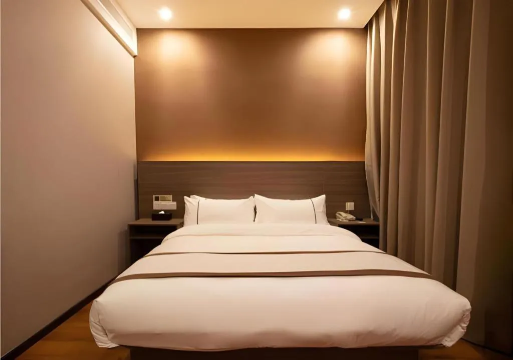 Bed in Jtour Inn Wuxi Meiyuan Kaiyuan Temple Metro