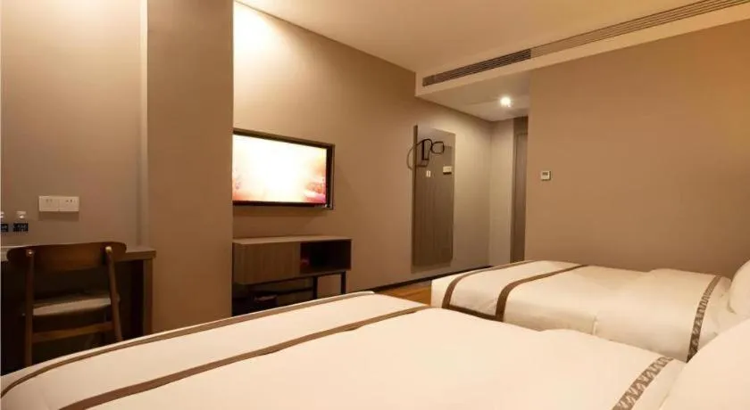 Bed in Jtour Inn Wuxi Meiyuan Kaiyuan Temple Metro