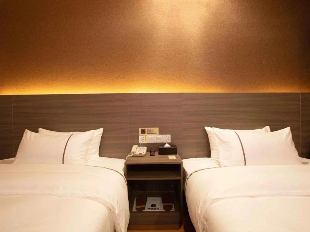 Bed in Jtour Inn Wuxi Meiyuan Kaiyuan Temple Metro