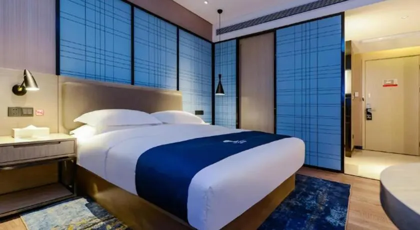 Bed in Echarm Hotel Guiyang Longdongbao International Airport Outlets
