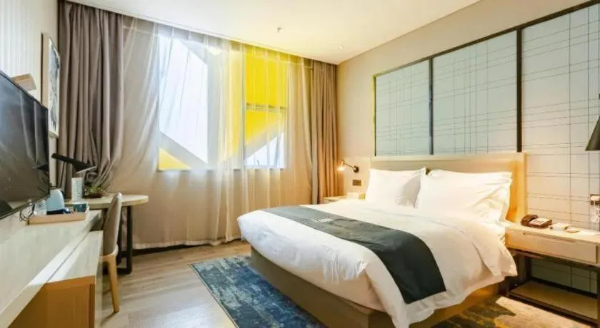 Bed in Echarm Hotel Guiyang Longdongbao International Airport Outlets