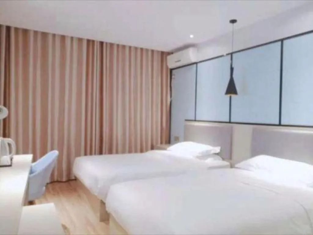 Bed in Borrman Hotel Hefei Guogou Plaza Sanli'an Metro Station