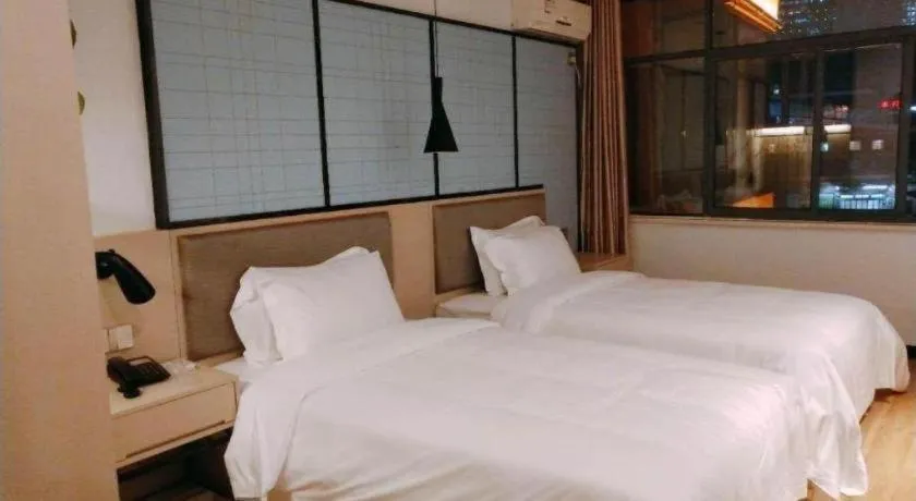 Bed in Borrman Hotel Hefei Guogou Plaza Sanli'an Metro Station
