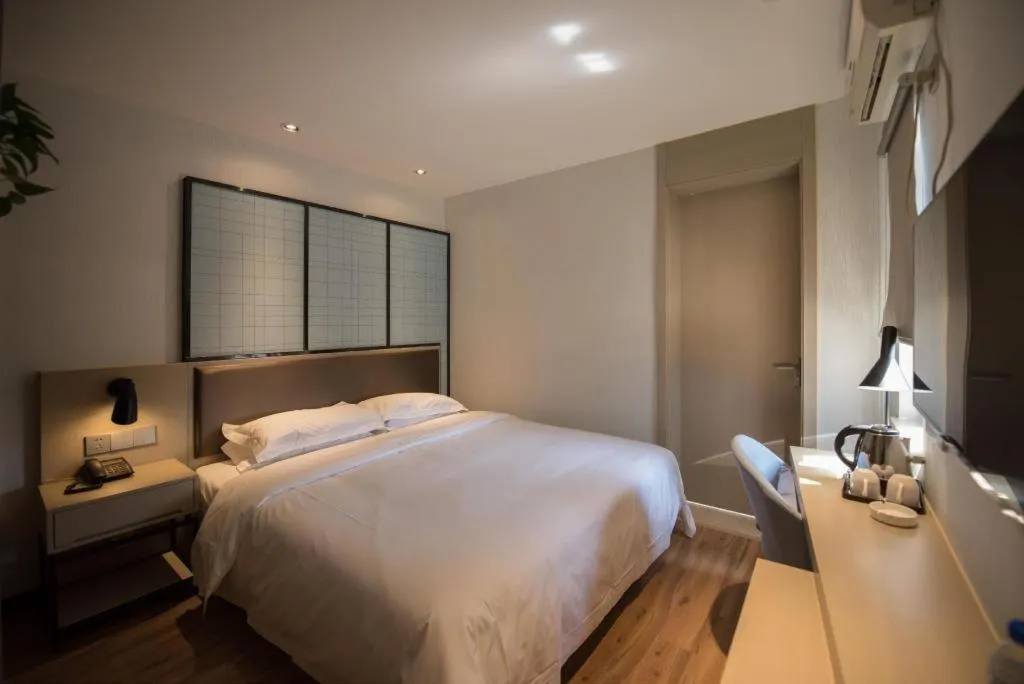 Bed in Borrman Hotel Hefei Guogou Plaza Sanli'an Metro Station