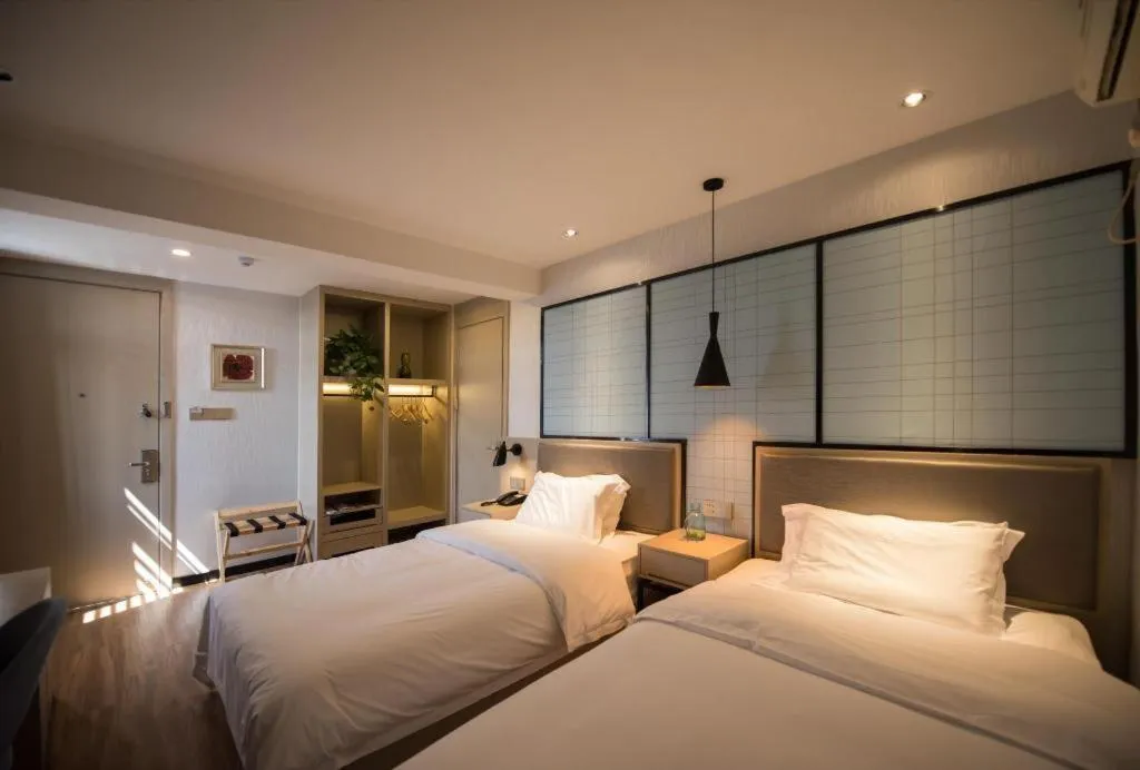 Bed in Borrman Hotel Hefei Guogou Plaza Sanli'an Metro Station