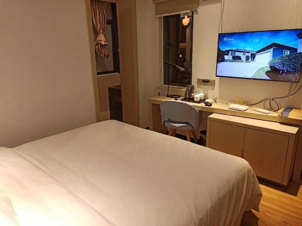 Bed in Borrman Hotel Hefei Guogou Plaza Sanli'an Metro Station