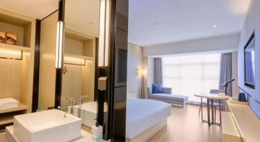 Bed in Echarm Hotel Aegean Shopping Park Zhonghuan Plaza