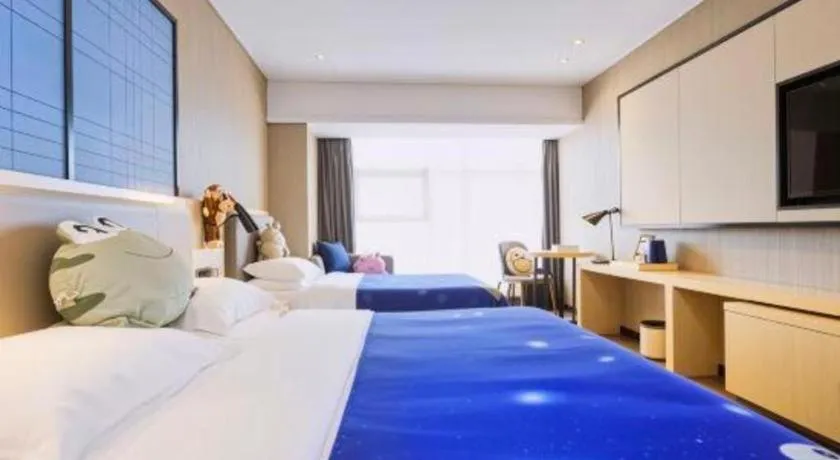 Bed in Echarm Hotel Aegean Shopping Park Zhonghuan Plaza