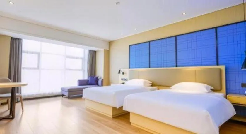 Bed in Echarm Hotel Aegean Shopping Park Zhonghuan Plaza