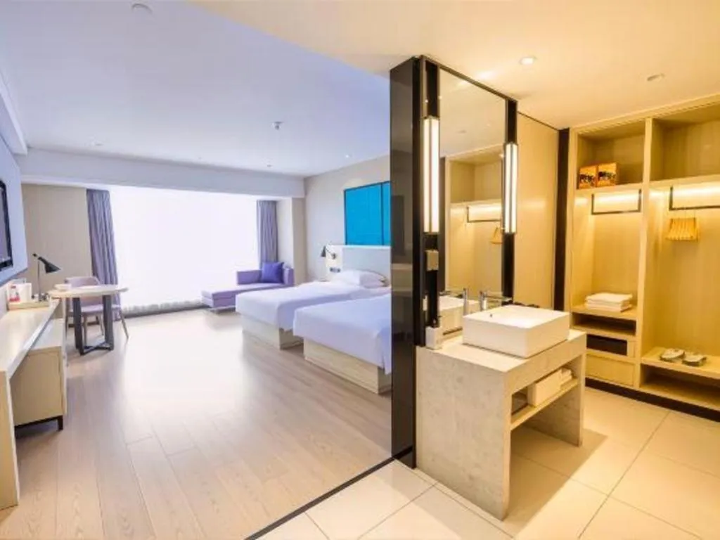 Bed in Echarm Hotel Aegean Shopping Park Zhonghuan Plaza