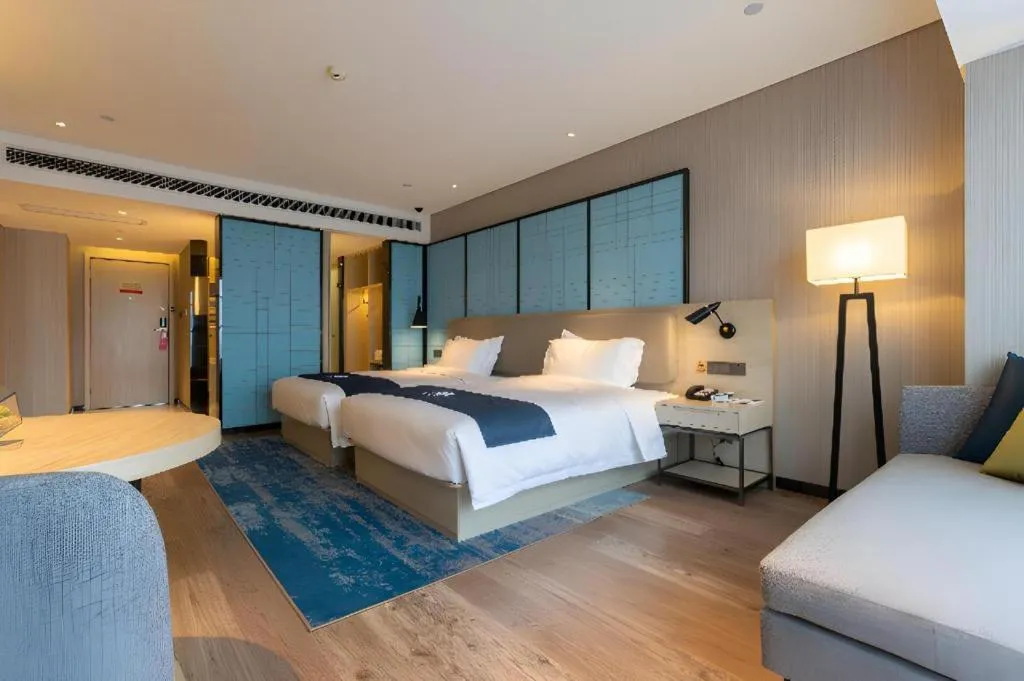 Bed in Echarm Hotel Aegean Shopping Park Zhonghuan Plaza
