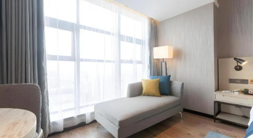 Bed in Echarm Hotel Aegean Shopping Park Zhonghuan Plaza