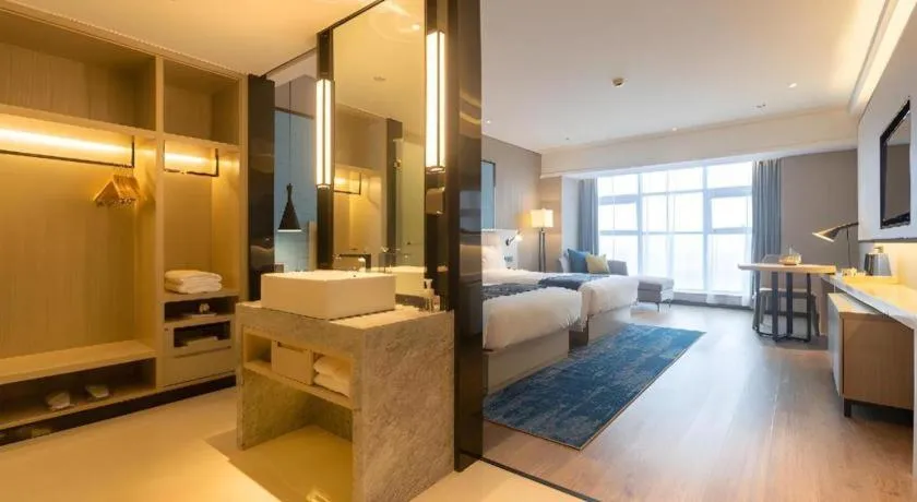 Bed in Echarm Hotel Aegean Shopping Park Zhonghuan Plaza