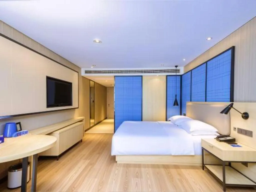 Bed in Echarm Hotel Aegean Shopping Park Zhonghuan Plaza